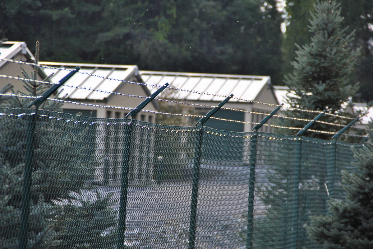 Harrison Avenue self storage building exterior and fence