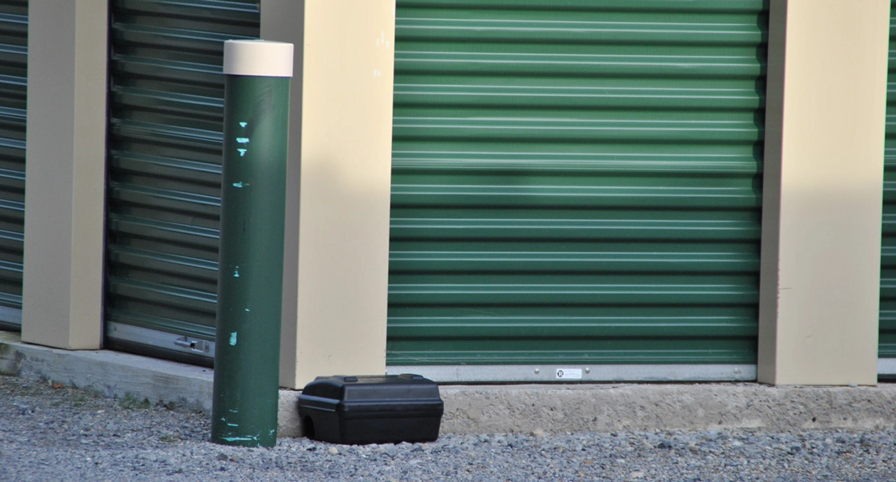 close up of rat trap next to storage unit